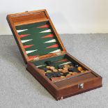 A mid 20th century backgammon set, in a mahogany box,