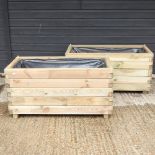 A pair of wooden slatted garden planters,