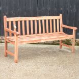 A teak slatted garden bench,