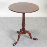 A 19th century parquetry occasional table, on a platform base,