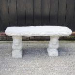 A reconstituted stone garden bench, with supports in the form of squirrels,
