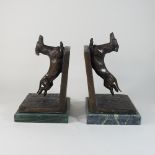 A pair of modern bronzed bookends, in the form of dogs,
