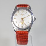 A 1950's Longines gentleman's steel cased wristwatch, the signed dial with secondary seconds dial,