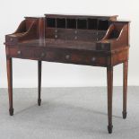 An early 20th century mahogany desk, of Carleton House design,