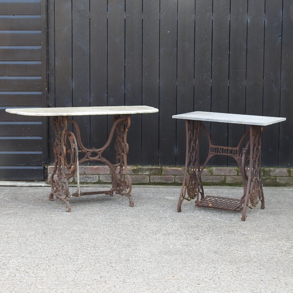 A cast iron sewing table, with a marble top, 121cm,