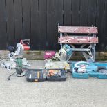 A Makita mitre saw, together with a Makita grinder,