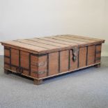 A large early 20th century Indian hardwood trunk/coffee table, with a hinged lid,