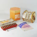 A mid 20th century Scholer concertina, cased,