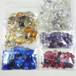 A collection of unmounted gemstones and coloured glass beads