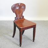 A William IV carved mahogany hall chair