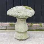 An antique carved granite staddle stone, 52cm.