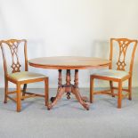 A Victorian inlaid oval dining table, with a hinged top, 117 x 82cm,