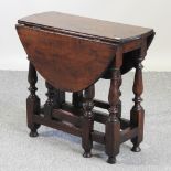 An oak gateleg occasional table,