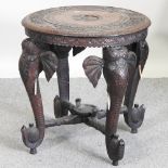 An early 20th century Indian carved hardwood occasional table,