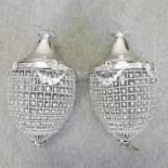 A pair of modern silver painted metal ceiling lights, in the form of acorns,