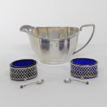 A pair of Victorian pierced silver salts, with blue glass liners Birmingham 1899,