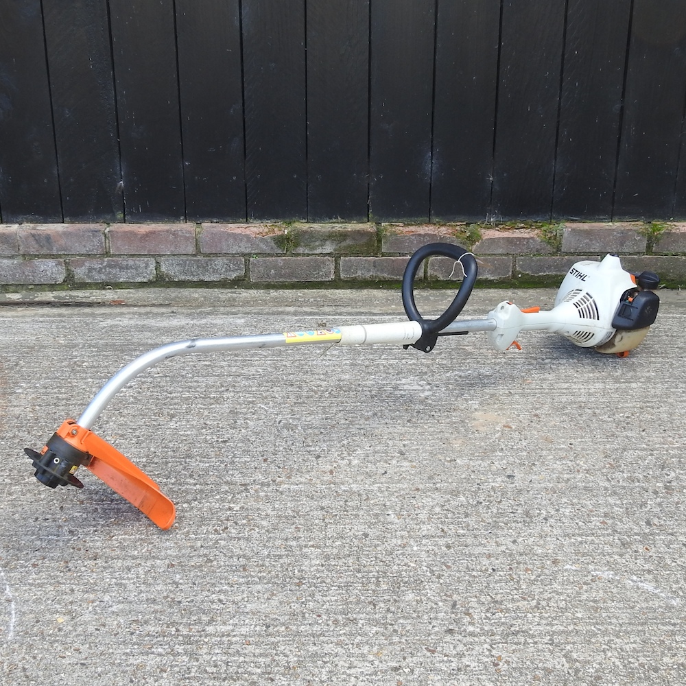 A Stihl petrol garden strimmer