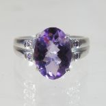 A large 9 carat gold and amethyst dress ring, size R, 5.