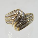 A large 9 carat gold and diamond ring, of crossover design, size R, 6.