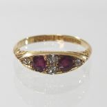 An 18 carat gold ruby and diamond ring, size O, 3.