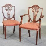 A set of eight mahogany dining chairs, with red padded seats,