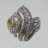 A large 9 carat gold and diamond dress ring, of asymmetrical design, size R, 7.
