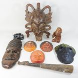 A collection of ethic carved wooden masks,