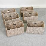 A set of six sea grass magazine baskets,