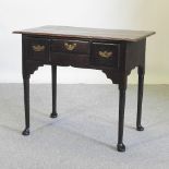 An 18th century oak lowboy, on pad feet,