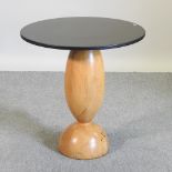 An Art Deco style occasional table, with a slate top on a light beech base,