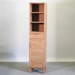 A modern teak narrow cabinet bookcase,