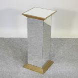 A mirrored glass pedestal,