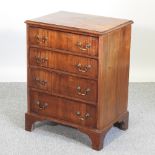A mahogany bedside chest, containing four drawers,