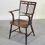 A 19th century elm seated Mendlesham chair