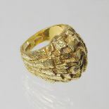 A large 18 carat gold ring, of textured design, size M, 10.