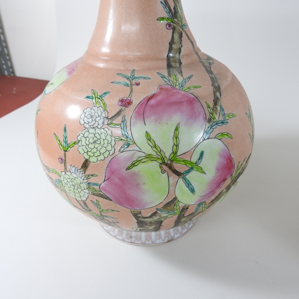 A pair of Chinese porcelain pink glazed gourd vases, painted with flowers, - Image 2 of 3
