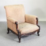 A 19th century beige upholstered high back wing armchair,