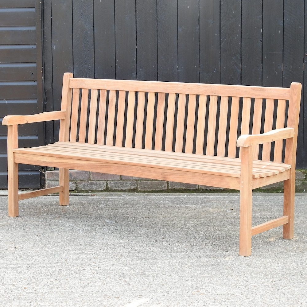 A teak slatted garden bench,