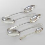 Four various silver old English pattern table spoons, London, Various dates,
