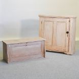 An antique pine cabinet, with a marble top, 92cm, together with an antique pine clerk's desk,
