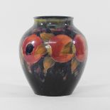A Moorcroft pomegranate pattern vase, of ovoid shape, signed and impressed marks to base,
