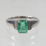 A 9 carat gold emerald and diamond ring, size R, 3.