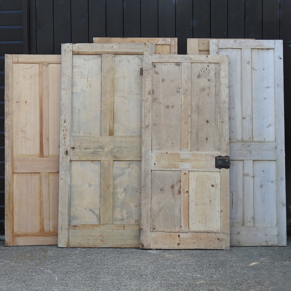 A collection of six various pine doors,