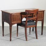 An Edwardian mahogany and inlaid writing desk, with a green inset writing surface,