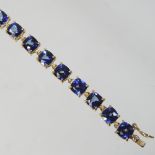 A 9 carat gold tourmaline line bracelet, 20cm long, 8.