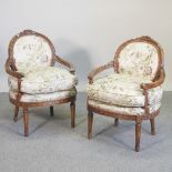 A pair of 20th century French style upholstered armchairs,