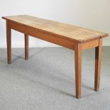 A hardwood serving table, on square legs,