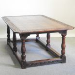 An 18th century and later carved oak refectory dining table,