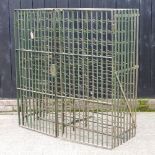 A large green painted metal wine rack,