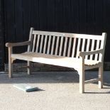 A teak slatted garden bench, with cover,